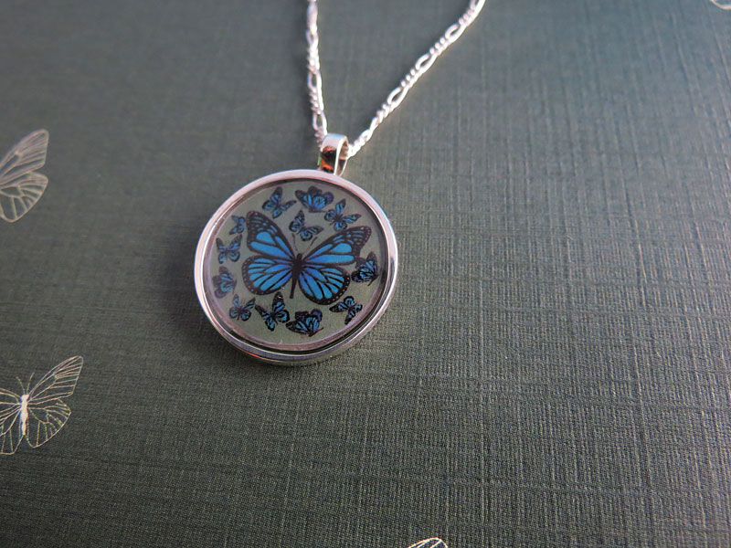 Dije Mariposas Encapsulado